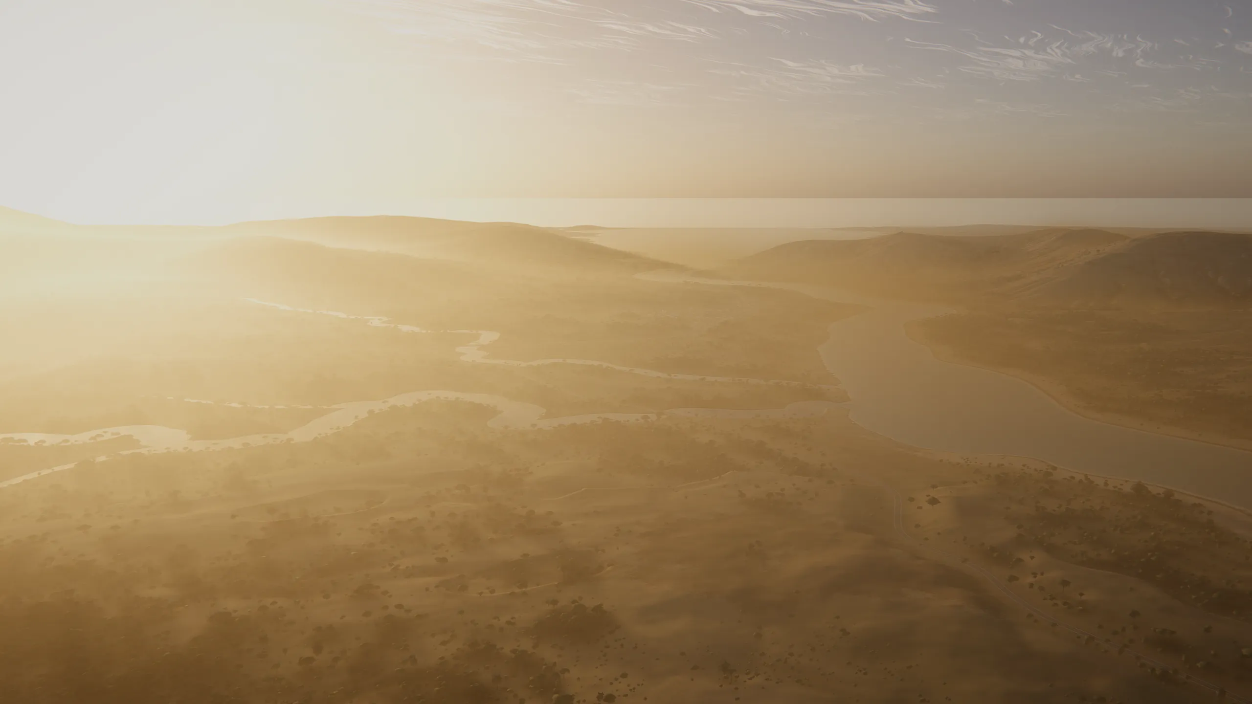 A river estuary on Valta in morning haze, low hills fading into the light